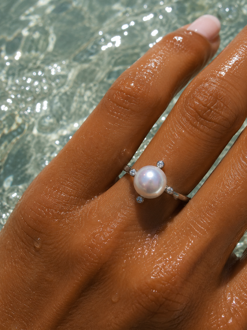 THE FOUR GLEAMS OF A PEARL RING